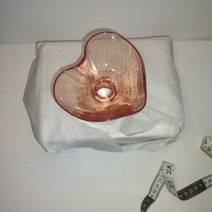 Heart shaped glass appears to be Valeria coupe glass Anthropologie